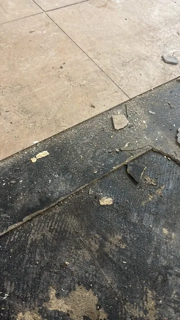 Black bitumen mastic floor removal in a NW5 flat